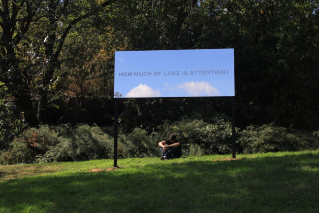 <p>Chloë Bass, <i>How Much of Love is Attention?</i>, 2019. Mirrored stainless steel with frosted vinyl lettering. Image courtesy of the artist and the Studio Museum in Harlem. Photo: SaVonne Anderson.
</p>
