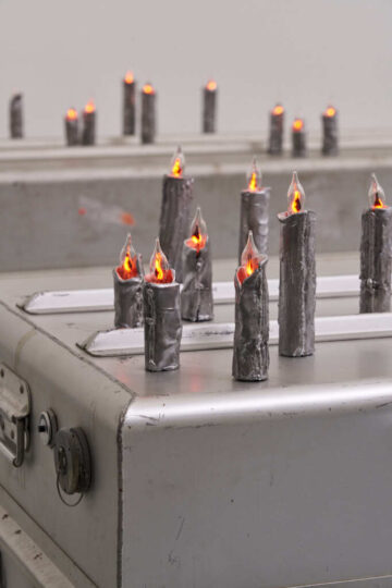 <p>Elaine Cameron-Weir,&nbsp;<em>Low Relief Icon (Figure 1) </em>and<em> Low Relief Icon (Figure 2) </em>[detail],&nbsp;2021. US military body transfer cases, aluminum, flicker bulbs, electrical wiring, conveyor belt, pewter, chain, pulleys, aircraft cable, hardware. Courtesy of the artist, JTT, New York, and Hannah Hoffman, Los Angeles.&nbsp; Installation view of&nbsp;<em>Elaine Cameron-Weir: STAR CLUB REDEMPTION BOOTH</em>, 2021, Henry Art Gallery, University of Washington, Seattle. Photo: Jonathan Vanderweit.</p>
