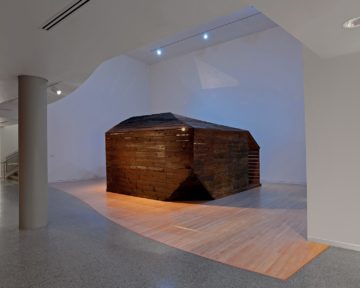 <p>Edgar Arceneaux (U.S., born 1972). <i>Library of Black Lies.</i> 2016. Wood, mirrored glass, mylar, newspaper, hard-bound books, sugar crystals, lighting fixtures, audio component. Courtesy of the artist. [installation view <i>in EdgarArceneaux: Library of Black Lies</i>, Henry Art Gallery, University of Washington, Seattle. 2018]. Photo: Mark Woods, courtesy of the Henry.</p>
