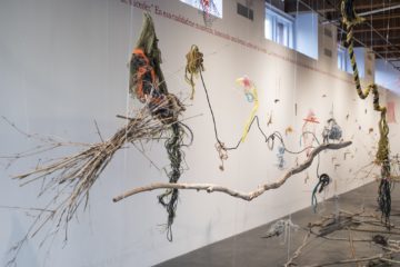 <p>Cecilia Vicuña (Chile, born 1948). <em>Balsa Snake Raft to Escape the Flood</em>, 2017. Site-specific installation with found materials sourced from New Orleans, Chile, and New York: debris, bamboo, willows, twigs, fishing line, beads, rope, net, styrofoam, plastic, and feathers. [Installation view, <em>Cecilia Vicuña: About to Happen</em>, 2017. Contemporary Arts Center, New Orleans.] Photo: Alex Marks.</p>
